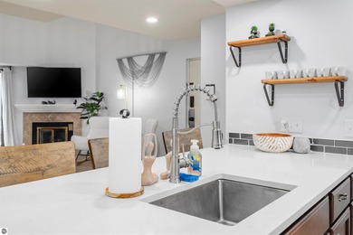 Perched above the third tee of Spruce Run Golf Course, this on Grand Traverse Resort and Spa in Michigan - for sale on GolfHomes.com, golf home, golf lot