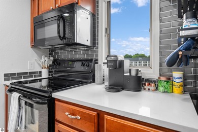 Perched above the third tee of Spruce Run Golf Course, this on Grand Traverse Resort and Spa in Michigan - for sale on GolfHomes.com, golf home, golf lot