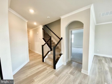 MOVE IN READY-FINISHED BASEMENT AND UPPER LEVEL!  Photos are of on Plantation Lakes Golf and Country Club in Delaware - for sale on GolfHomes.com, golf home, golf lot