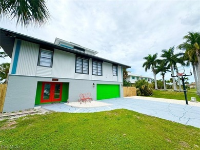 Discover refined living in this exceptional three-story on Alden Pines Golf Club in Florida - for sale on GolfHomes.com, golf home, golf lot