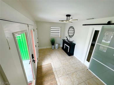 Discover refined living in this exceptional three-story on Alden Pines Golf Club in Florida - for sale on GolfHomes.com, golf home, golf lot