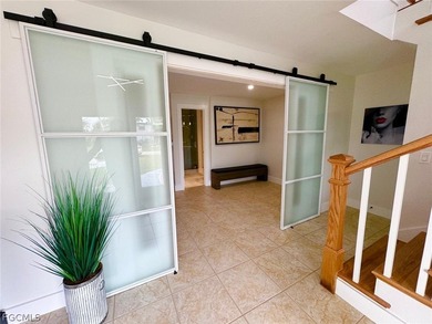 Discover refined living in this exceptional three-story on Alden Pines Golf Club in Florida - for sale on GolfHomes.com, golf home, golf lot