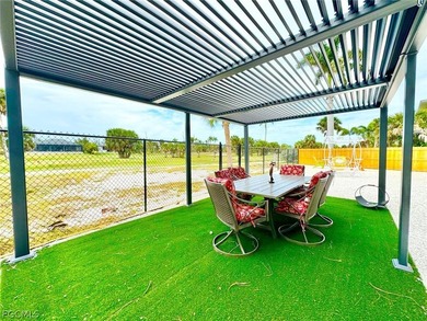 Discover refined living in this exceptional three-story on Alden Pines Golf Club in Florida - for sale on GolfHomes.com, golf home, golf lot