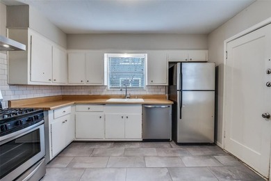 Fully leased duplex in the desirable Kings Highway neighborhood on Stevens Park Golf Course in Texas - for sale on GolfHomes.com, golf home, golf lot