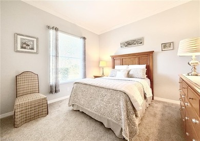 Beautifully maintained 2BR + Den / 2BA / 2-Car Garage villa with on Naples Heritage Golf and Country Club in Florida - for sale on GolfHomes.com, golf home, golf lot