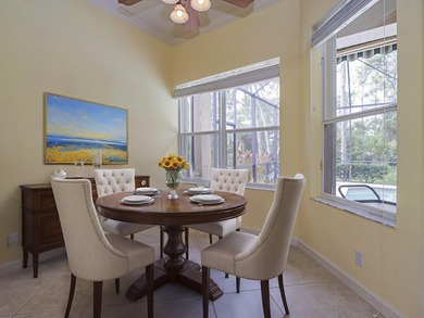 This exceptional 3-bedroom, 2-bathroom screened Pool home with on Champions Club at Summerfield in Florida - for sale on GolfHomes.com, golf home, golf lot