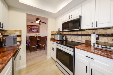 COMPLETELY REMODELED AND UPDATED 3/2/2 SAILBOAT WATER POOL HOME on Saint Andrews South Golf Club in Florida - for sale on GolfHomes.com, golf home, golf lot