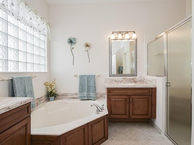 This exceptional 3-bedroom, 2-bathroom screened Pool home with on Champions Club at Summerfield in Florida - for sale on GolfHomes.com, golf home, golf lot