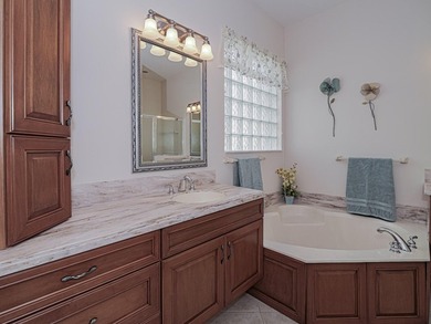 This exceptional 3-bedroom, 2-bathroom screened Pool home with on Champions Club at Summerfield in Florida - for sale on GolfHomes.com, golf home, golf lot