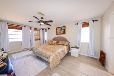 COMPLETELY REMODELED AND UPDATED 3/2/2 SAILBOAT WATER POOL HOME on Saint Andrews South Golf Club in Florida - for sale on GolfHomes.com, golf home, golf lot