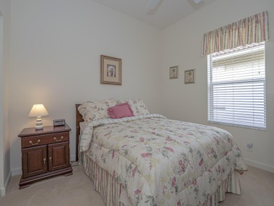 This exceptional 3-bedroom, 2-bathroom screened Pool home with on Champions Club at Summerfield in Florida - for sale on GolfHomes.com, golf home, golf lot