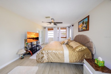 COMPLETELY REMODELED AND UPDATED 3/2/2 SAILBOAT WATER POOL HOME on Saint Andrews South Golf Club in Florida - for sale on GolfHomes.com, golf home, golf lot