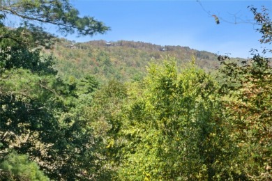 Nestled on a sprawling private lot, this enchanting on Sapphire National Golf Club in North Carolina - for sale on GolfHomes.com, golf home, golf lot