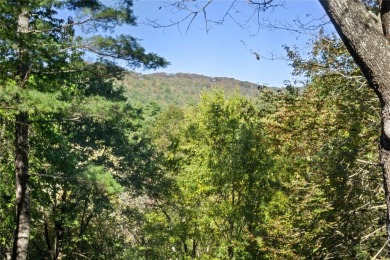 Nestled on a sprawling private lot, this enchanting on Sapphire National Golf Club in North Carolina - for sale on GolfHomes.com, golf home, golf lot