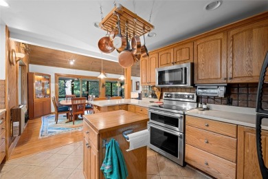 Nestled on a sprawling private lot, this enchanting on Sapphire National Golf Club in North Carolina - for sale on GolfHomes.com, golf home, golf lot