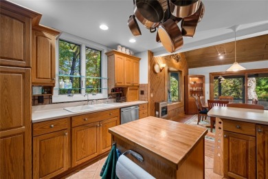 Nestled on a sprawling private lot, this enchanting on Sapphire National Golf Club in North Carolina - for sale on GolfHomes.com, golf home, golf lot
