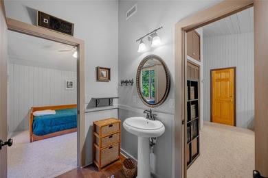 Nestled on a sprawling private lot, this enchanting on Sapphire National Golf Club in North Carolina - for sale on GolfHomes.com, golf home, golf lot