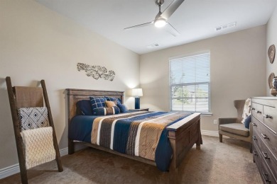 Beautifully landscaped single-story home with an inviting open on Wildhorse Golf Club of Robson Ranch in Texas - for sale on GolfHomes.com, golf home, golf lot