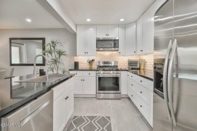 Discover refined living in this end unit gated townhome in Los on Los Robles Greens Golf Course in California - for sale on GolfHomes.com, golf home, golf lot