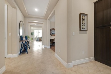 Beautifully landscaped single-story home with an inviting open on Wildhorse Golf Club of Robson Ranch in Texas - for sale on GolfHomes.com, golf home, golf lot