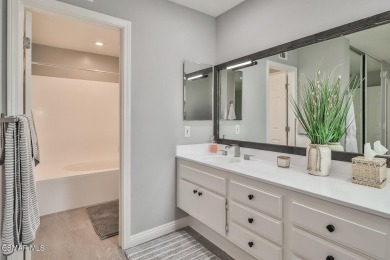 Discover refined living in this end unit gated townhome in Los on Los Robles Greens Golf Course in California - for sale on GolfHomes.com, golf home, golf lot