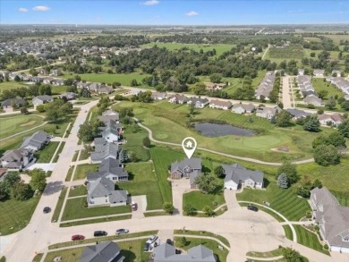 This beautiful 2-story home overlooks the par-3 4th hole at on Hunters Ridge Golf Course in Iowa - for sale on GolfHomes.com, golf home, golf lot