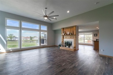 This beautiful 2-story home overlooks the par-3 4th hole at on Hunters Ridge Golf Course in Iowa - for sale on GolfHomes.com, golf home, golf lot