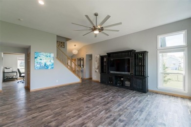 This beautiful 2-story home overlooks the par-3 4th hole at on Hunters Ridge Golf Course in Iowa - for sale on GolfHomes.com, golf home, golf lot