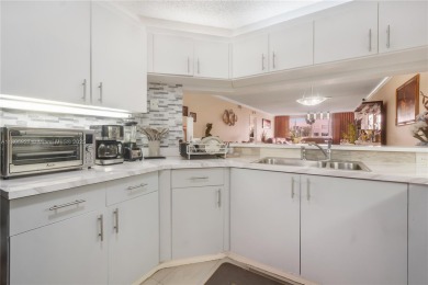 Beautifully renovated apartment seamlessly blends modern designs on Sunrise Lakes Phase IV Golf Course in Florida - for sale on GolfHomes.com, golf home, golf lot