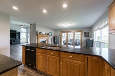 This beautiful 2-story home overlooks the par-3 4th hole at on Hunters Ridge Golf Course in Iowa - for sale on GolfHomes.com, golf home, golf lot