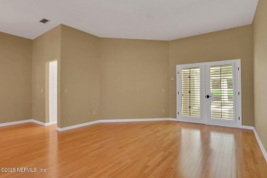 ''Sandwedged'' between the 11th and 12th holes, this Country on Jacksonville Golf and Country Club in Florida - for sale on GolfHomes.com, golf home, golf lot