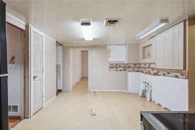 Endless Potential! Fixer-Upper Opportunity Close to Lake on Lake McBride Golf Course in Iowa - for sale on GolfHomes.com, golf home, golf lot