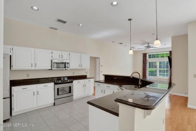 ''Sandwedged'' between the 11th and 12th holes, this Country on Jacksonville Golf and Country Club in Florida - for sale on GolfHomes.com, golf home, golf lot