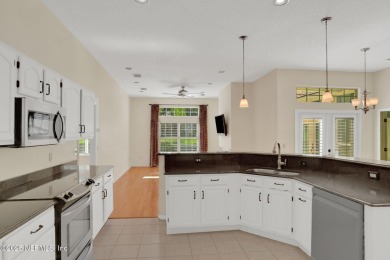 ''Sandwedged'' between the 11th and 12th holes, this Country on Jacksonville Golf and Country Club in Florida - for sale on GolfHomes.com, golf home, golf lot
