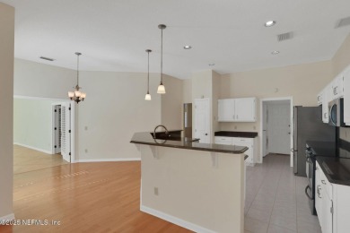 ''Sandwedged'' between the 11th and 12th holes, this Country on Jacksonville Golf and Country Club in Florida - for sale on GolfHomes.com, golf home, golf lot