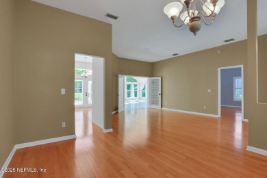 ''Sandwedged'' between the 11th and 12th holes, this Country on Jacksonville Golf and Country Club in Florida - for sale on GolfHomes.com, golf home, golf lot