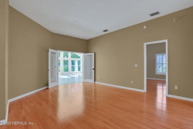 ''Sandwedged'' between the 11th and 12th holes, this Country on Jacksonville Golf and Country Club in Florida - for sale on GolfHomes.com, golf home, golf lot