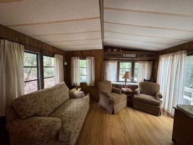 Linville Land Harbor- Relax on the covered deck and  enjoy the on Land Harbor Golf Course in North Carolina - for sale on GolfHomes.com, golf home, golf lot