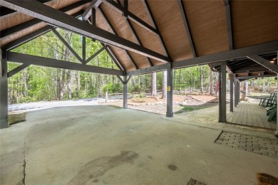 Nestled in the sought-after Holly Forest community, this on Sapphire National Golf Club in North Carolina - for sale on GolfHomes.com, golf home, golf lot
