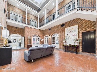 An Iconic French Quarter-Inspired Estate in the Heart of on LeTriomphe Golf and Country Club in Louisiana - for sale on GolfHomes.com, golf home, golf lot