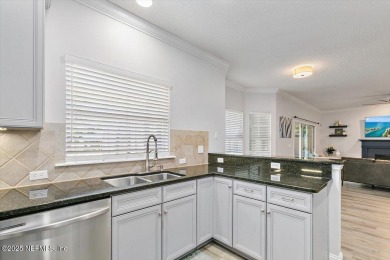 Outdoors is where you'll truly live in this gorgeous pool home on St. Johns Golf and Country Club in Florida - for sale on GolfHomes.com, golf home, golf lot