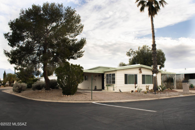 Updated home on a corner lot with 2 separate carports. Recently on Country Club of Green Valley in Arizona - for sale on GolfHomes.com, golf home, golf lot