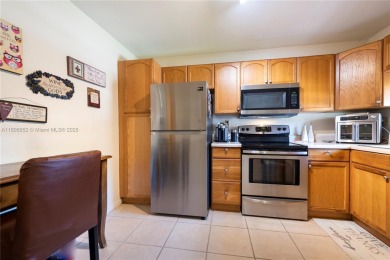 Charming one-bedroom, one and a half-bath condo in Hollybrook, a on Hollybrook Golf and Tennis Club  in Florida - for sale on GolfHomes.com, golf home, golf lot
