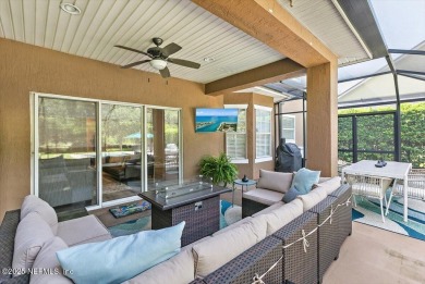 Outdoors is where you'll truly live in this gorgeous pool home on St. Johns Golf and Country Club in Florida - for sale on GolfHomes.com, golf home, golf lot