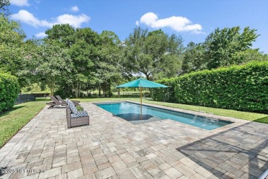 Outdoors is where you'll truly live in this gorgeous pool home on St. Johns Golf and Country Club in Florida - for sale on GolfHomes.com, golf home, golf lot