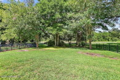Outdoors is where you'll truly live in this gorgeous pool home on St. Johns Golf and Country Club in Florida - for sale on GolfHomes.com, golf home, golf lot