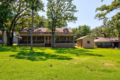 Stunning 5BR, 2.5BA golf course home with lake views on Hole #14 on Lake Kiowa Golf Course in Texas - for sale on GolfHomes.com, golf home, golf lot