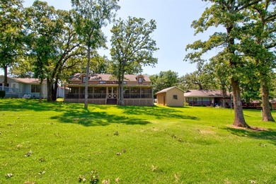 Stunning 5BR, 2.5BA golf course home with lake views on Hole #14 on Lake Kiowa Golf Course in Texas - for sale on GolfHomes.com, golf home, golf lot