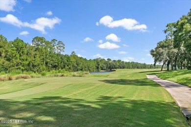 Outdoors is where you'll truly live in this gorgeous pool home on St. Johns Golf and Country Club in Florida - for sale on GolfHomes.com, golf home, golf lot