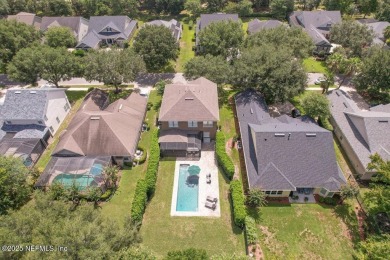 Outdoors is where you'll truly live in this gorgeous pool home on St. Johns Golf and Country Club in Florida - for sale on GolfHomes.com, golf home, golf lot